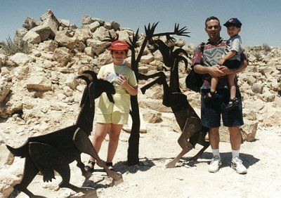 [Avi, Shira and Yovel with metal sculptures of goats]