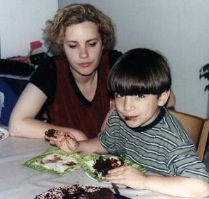 Yohai feeding cake to his face