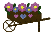 wheel barrow full of flowers and hearts