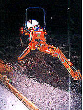 Hubby digging at night with the tractor