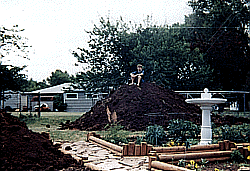 My son on one of the dirt piles (the smaller pile is in the bottom left corner