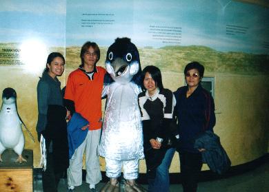 At Penguin Parade. From left: me, Gump, penguin, Shu Jing and mum