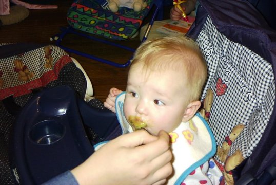 Elizabeth eating green beans