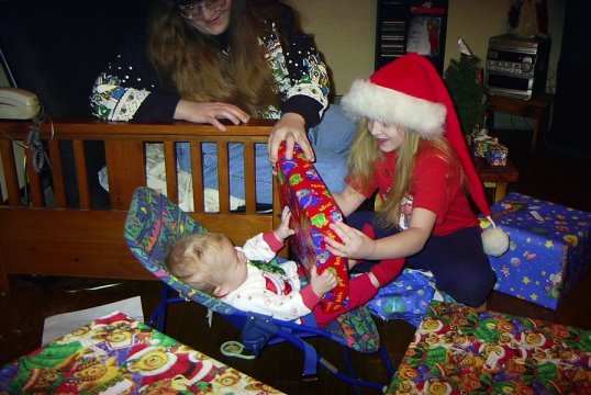 Kasey and Elizabeth opening Christmas gifts