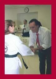 Bobbi Davis accepting Black Belt from Sobmonim Jay Helfman