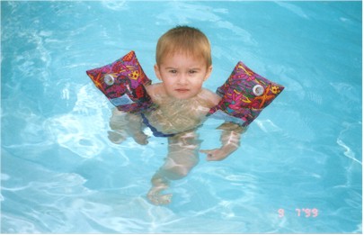 Ryan with his swimmies on