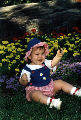 Mira sitting in the flowers