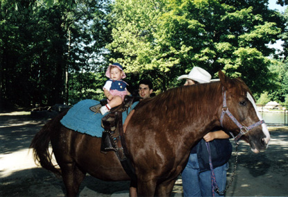 Mira tries to ride a horse