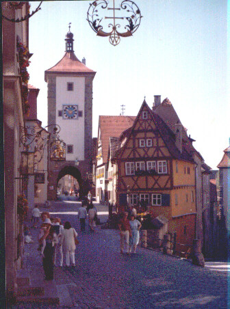 Donna holding Jessica and Monika on famous street in Rotenburg