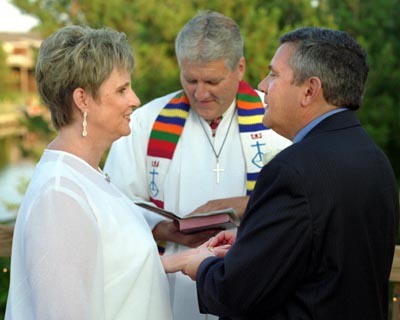 Pat places the ring on Margaret's hand