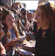 signing autographs