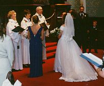 Francie and Andy at the alter with three clebrants