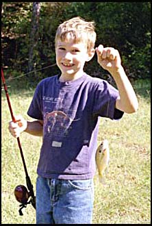 Buddy catches a fish at camp