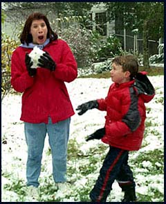 Marcia and Benjamin in snowball fight