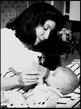 Marcia feeding Benjamin