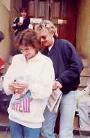 Roger signing my sweatshirt, his son Felix in the background! 1989