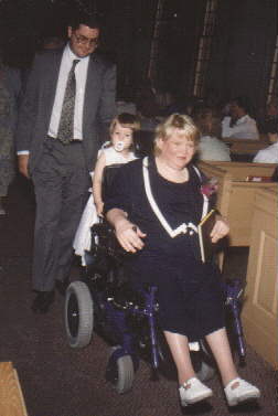 here I am riding back down the aisle on the back of mommy's  chair.