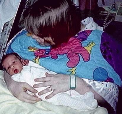 Mom holds Diana after nursing