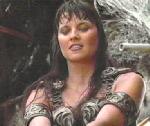 Xena pointing sword down at another