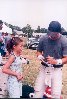 Keanu signing something for a young fan