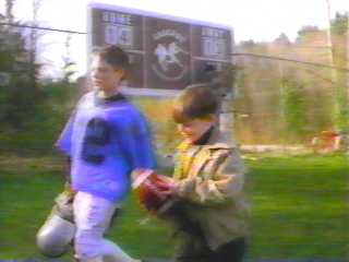 Young Jim and Steven at the football game (Remembrance)