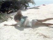 Elizabeth rolling down dune