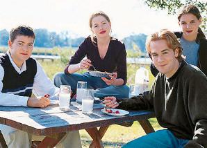 DC Cast sitting at a pinic table