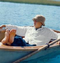 Josh relaxing (barefoot) in a canoe