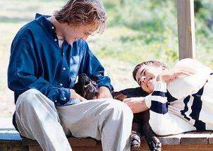 James Van Der Beek and Joshua Jackson with a black dog