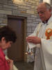 Dad gives communion to Mom (April 2006)