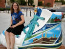 Sarah Mae hanging out with one of the shoes at the library