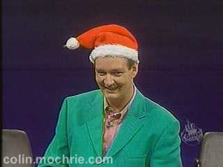 Colin Mochrie in Santa hat