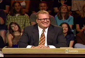 Drew Carey at desk