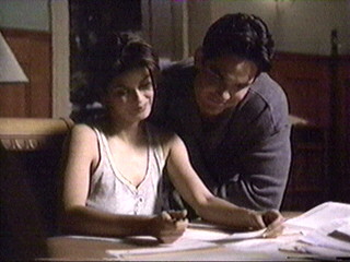 Lois & Clark looking at scrapbooks