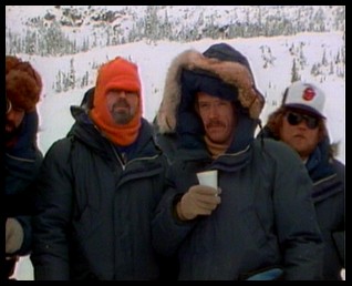 DOP Dean Cundey, in red ski mask, director Carpenter, with cup