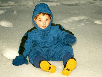 Ari sitting in snow