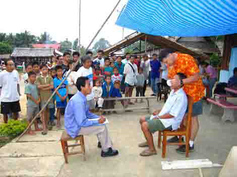 Tooth Aid … Paul Kotala, who has won a humanitarian of the year award, works on a patient in Laos.