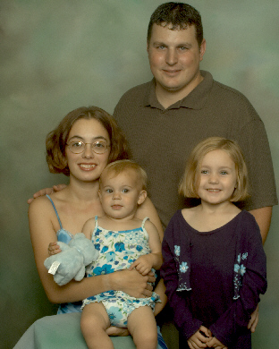 This is my lovely wife, our beautiful daughters and me.