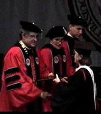 Dusti gets her handshake and her B.A. degree in Philosophy!