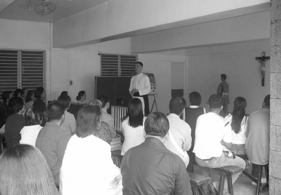 The church basement hall where the Catechism classes for adults are held every Sunday after the 9:00 am Sung Mass.
The former prior, Fr. Vicente Griego is seen here conducting one of these Sunday classes. This hall is also a place for various church activities such as symposia, conferences, pot-luck dinners, exhibits, medical missions, etc.