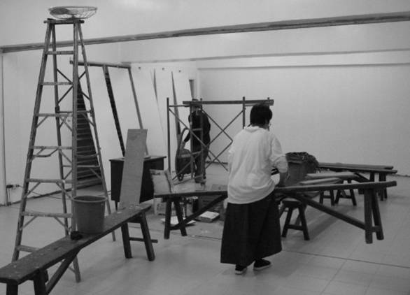 Fixing the interior of the classrooms; the planks of wood in the background will be used for the accordion-type partition that will divide the roomit is of this type for easy collapsing when both rooms will be used for a parish activity.