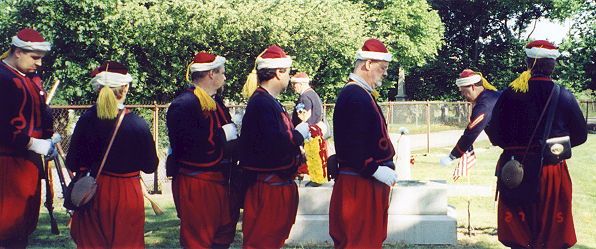 Zouaves place flowers on Major General Warren's grave