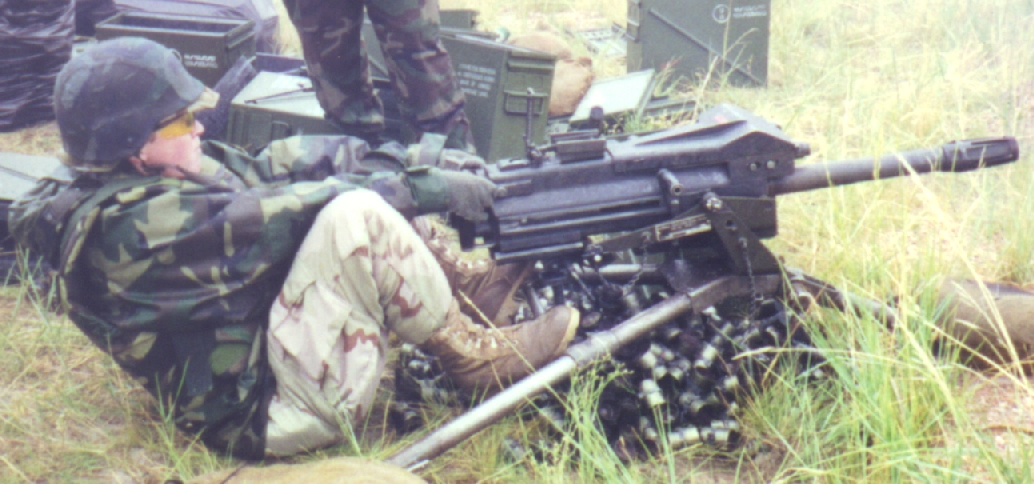 Ann firing the MK19 on a wet and rainy day