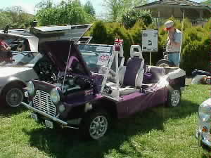 A purple Mini Moke