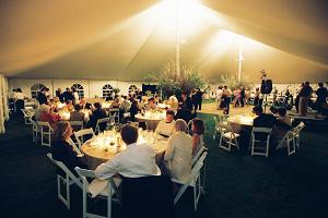 Epic Pole Tent Lighted During An Evening Reception