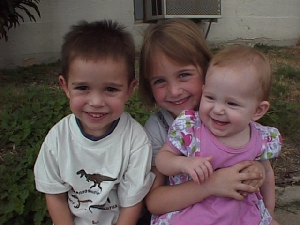 THIS IS ADRIENNE 6,THOMAS 3,AND MADELINE 1 1/2 AREN'T THEY CUTE?