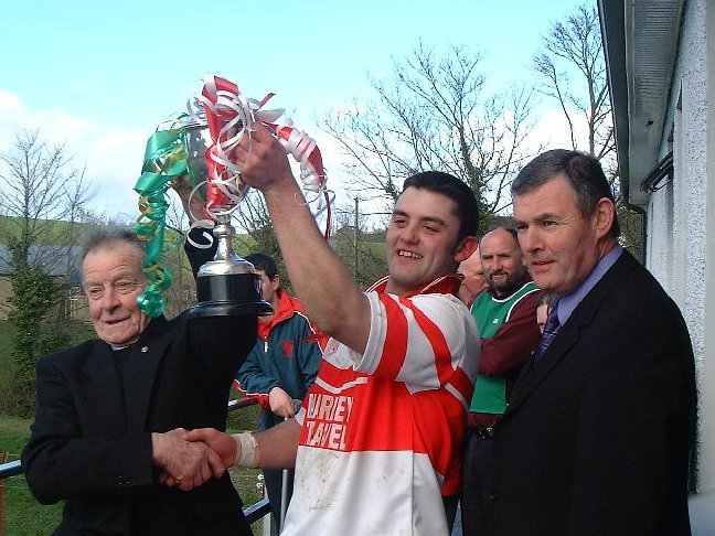 Glenfin captain, Mark McGinty proudly holding the McCully Cup