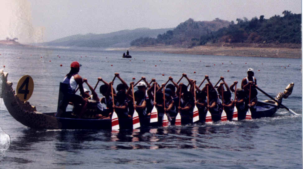 The Singapore Ladies Team in a full sized Dragon Boat at Jakarta Sea Games'97