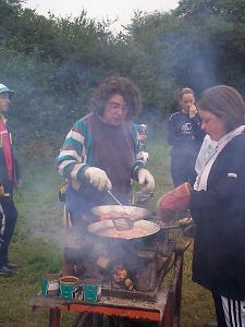 Kay cooking at camp