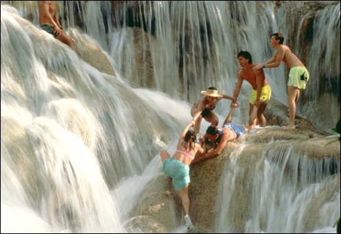 HUMAN DAISYCHAIN ON DUNNS RIVER FALLS: Photo Credit - Bob Krist